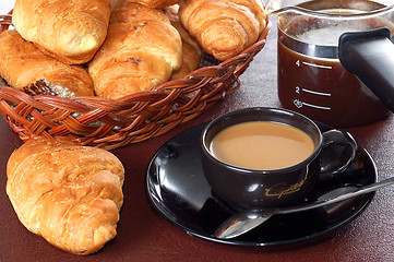 Image showing cup of coffee with fresh croissants