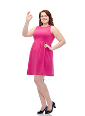 Image showing happy young plus size woman posing in pink dress