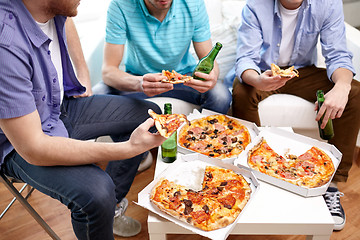 Image showing close up of friends with beer and pizza at home