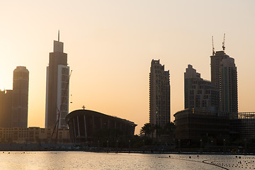 Image showing Dubai city skyscrapers on seafront at evening
