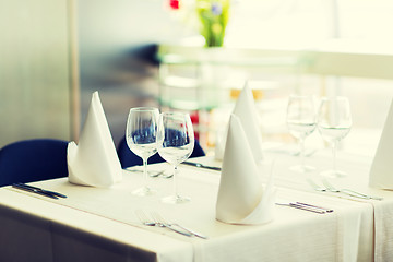 Image showing close up of table setting with glasses and cutlery