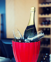 Image showing close up of champagne and glasses at restaurant