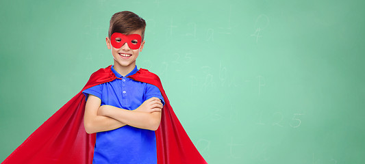 Image showing boy in red super hero cape and mask