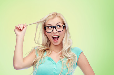 Image showing happy young woman or teenage girl in glasses