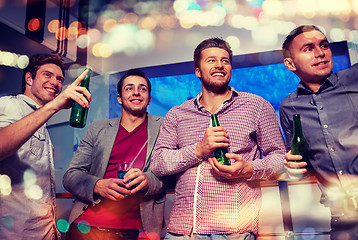 Image showing group of male friends with beer in nightclub