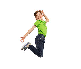 Image showing smiling boy jumping in air