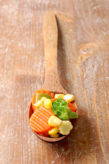 Image showing cooked carrots sweet corn and broccoli in a wooden spoon