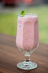 Image showing Strawberry smoothie on  table