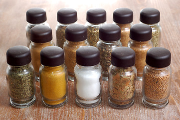 Image showing variety of spices in bottles