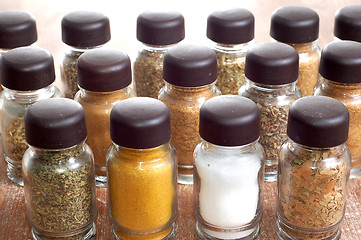 Image showing variety of spices in bottles