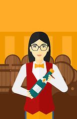 Image showing Waitress holding bottle of wine.