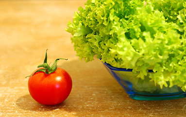 Image showing Fresh salad and a  tomato