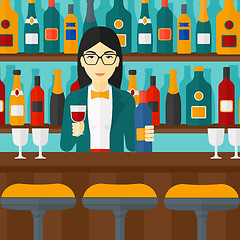 Image showing Bartender standing at the bar counter.