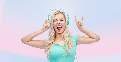 Image showing happy young woman or teenage girl with headphones