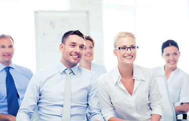 Image showing businessmen and businesswomen on conference