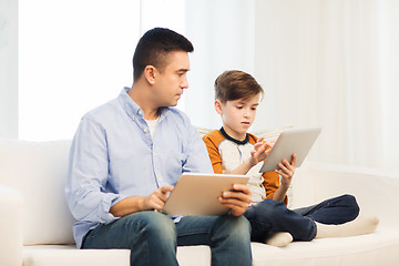 Image showing father and son with tablet pc at home