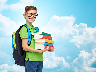 Image showing happy student boy with school bag and books