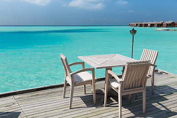 Image showing outdoor restaurant terrace with furniture over sea