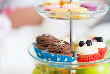 Image showing close up of cake stand with cupcakes and cookies