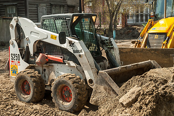 Image showing Close up of a bobcat or skid loader