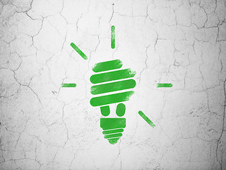 Image showing Finance concept: Energy Saving Lamp on wall background