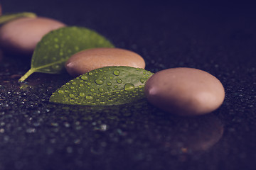 Image showing zen stones on black with water drops