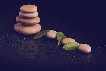 Image showing balancing zen stones on black