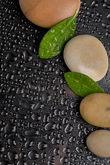 Image showing zen stones on black with water drops