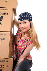 Image showing Portrait of a young woman with cardboard boxes