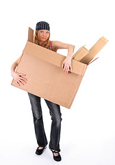 Image showing Young woman with a big cardboard box