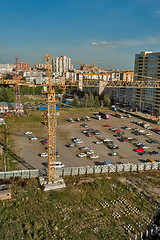 Image showing Crane on construction site and parking lot