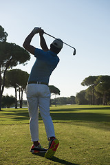 Image showing golf player hitting shot