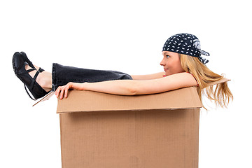 Image showing Girl sitting in a cardboard box