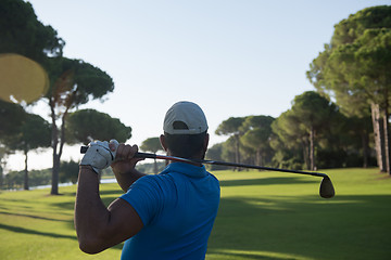 Image showing golf player hitting shot