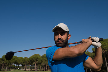 Image showing golf player hitting shot