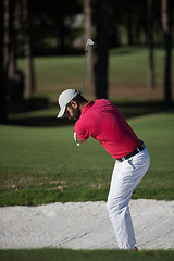 Image showing golfer hitting a sand bunker shot