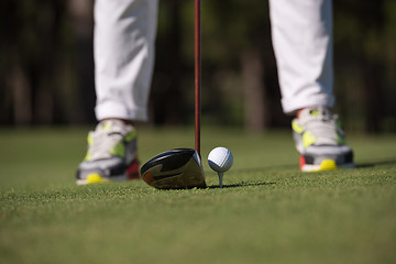 Image showing golf player hitting shot