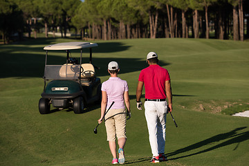 Image showing couple walking on golf course