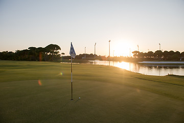 Image showing golf ball on edge of  the hole