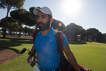 Image showing golf player walking