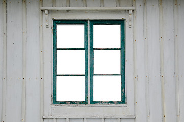 Image showing Cut out windowpanes in an old window
