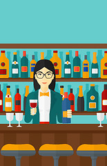 Image showing Bartender standing at the bar counter.