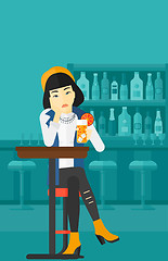 Image showing Woman sitting at bar.