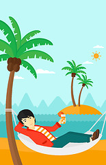 Image showing Man chilling in hammock.