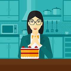 Image showing Woman looking at cake.