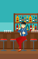 Image showing Man sitting at bar.