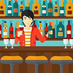 Image showing Bartender standing at the bar counter.