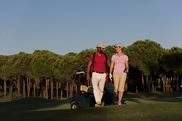 Image showing couple walking on golf course