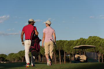 Image showing couple walking on golf course