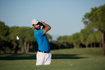 Image showing pro golfer hitting a sand bunker shot